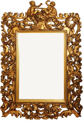 Lot 104 - A continental carved giltwood wall mirror