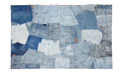 Lot 68 - An assembled denim patchwork rug