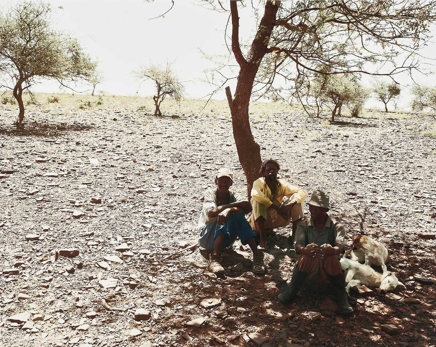 Lot 35 - David Goldblatt, South African 1930–2018 , Three men rest at the side of the track between Bute asbestos Mine and Heuningvlei in Northern Cape