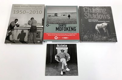 Lot 29 - , 'Santu Mofokeng: A Silent Solitude, Photographs 1982-2011' edited by Simon Njami, and three others